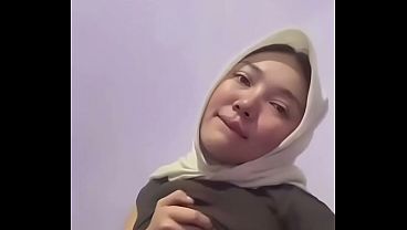 Malay hijabi slut with massive tits fingering her wet cunt till she squirts